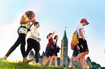 Student walking on Parliament Hill, Ottawa